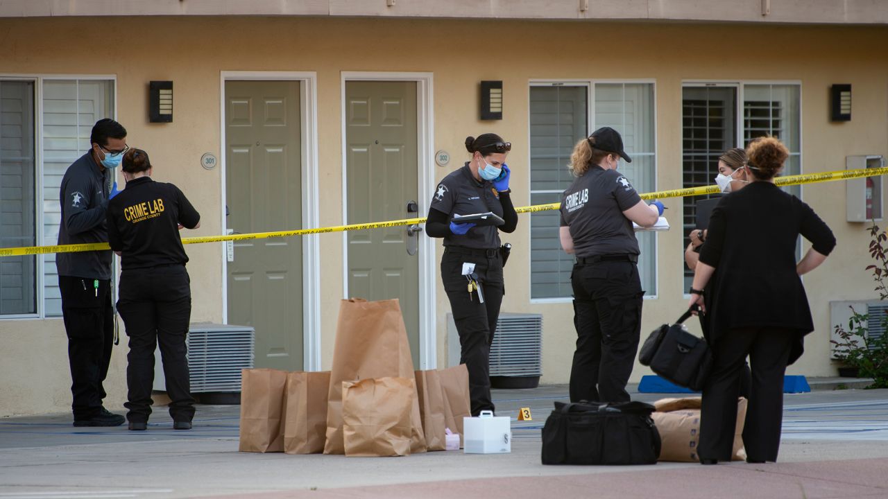 Investigators bag evidence from the scene outside the Hotel Miramar in San Clemente where Reinhold was shot and killed by deputies on Wednesday, September 23, 2020.