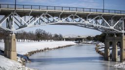 The Trinity River is mostly frozen after a snow storm Monday, Feb. 15, 2021, in Fort Worth, Texas. A frigid blast of winter weather across the U.S.  has left more than 2 million people in Texas without power. (Yffy Yossifor/Star-Telegram via AP)