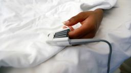 FILE PHOTO: A pulse oximeter is attached to a patient's finger to monitor oxygen intake within the body, at EHA Clinics in Abuja, Nigeria January 14, 2021. Picture taken January 14, 2021. REUTERS/Afolabi Sotunde/File Photo