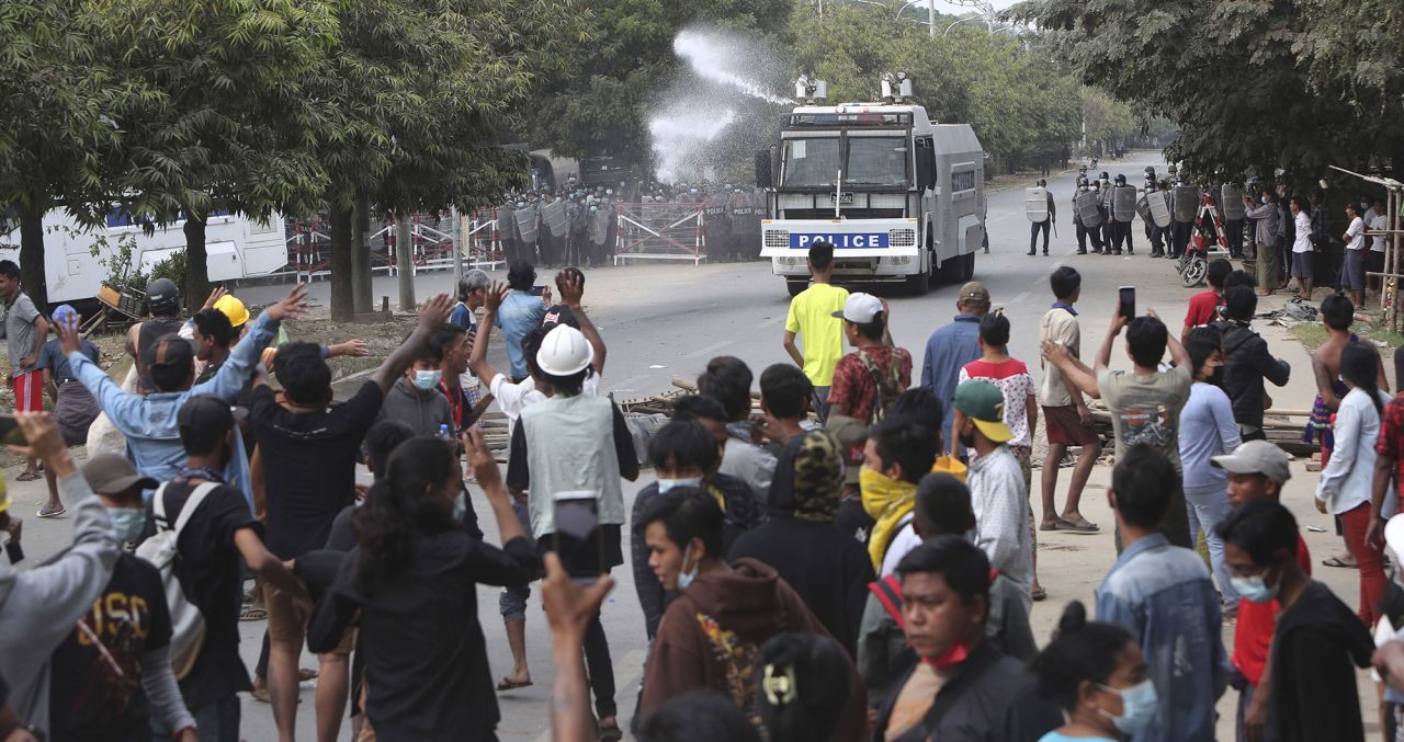 A police truck uses a water cannon to disperse protesters in Mandalay on February 20.