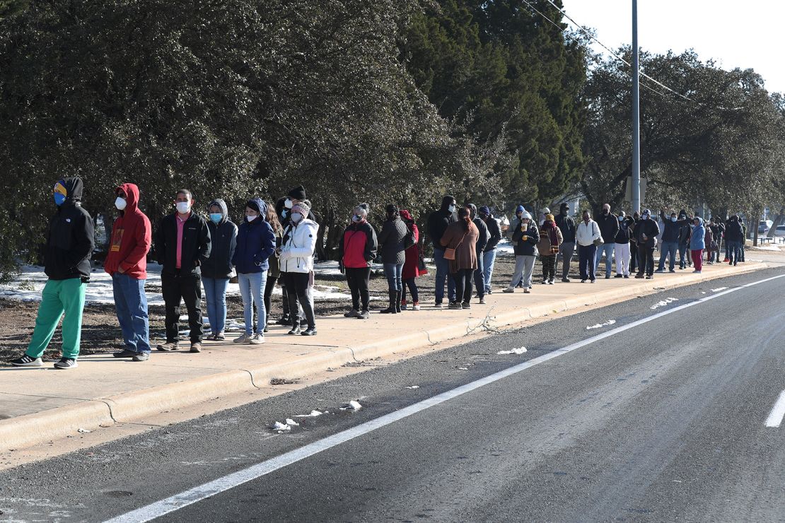 People wait for the Sam's Club store to open as they look to purchase essentials on Saturday, February 20, in Austin.