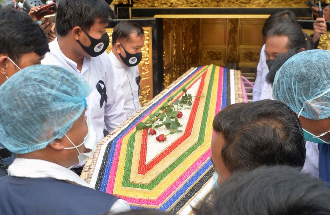 The 20-year-old's coffin is carried during Sunday's service.