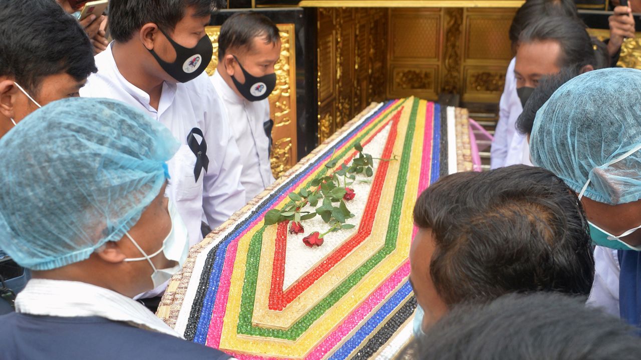 The 20-year-old's coffin is carried during Sunday's service.