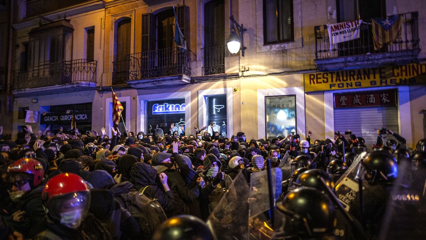 Protesters face off against a line of riot policeman in Barcelona during clashes on the fifth night of violent demonstrations condemning the arrest of rap artist Pablo Hasel