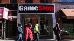 NEW YORK, NEW YORK - JANUARY 28: People walk by a GameStop store in Brooklyn on January 28, 2021 in New York City. Markets continue a volatile streak with the Dow Jones Industrial Average rising over 500 points in morning trading following yesterdays losses. Shares of the video game retailer GameStop plunged. (Photo by Spencer Platt/Getty Images)