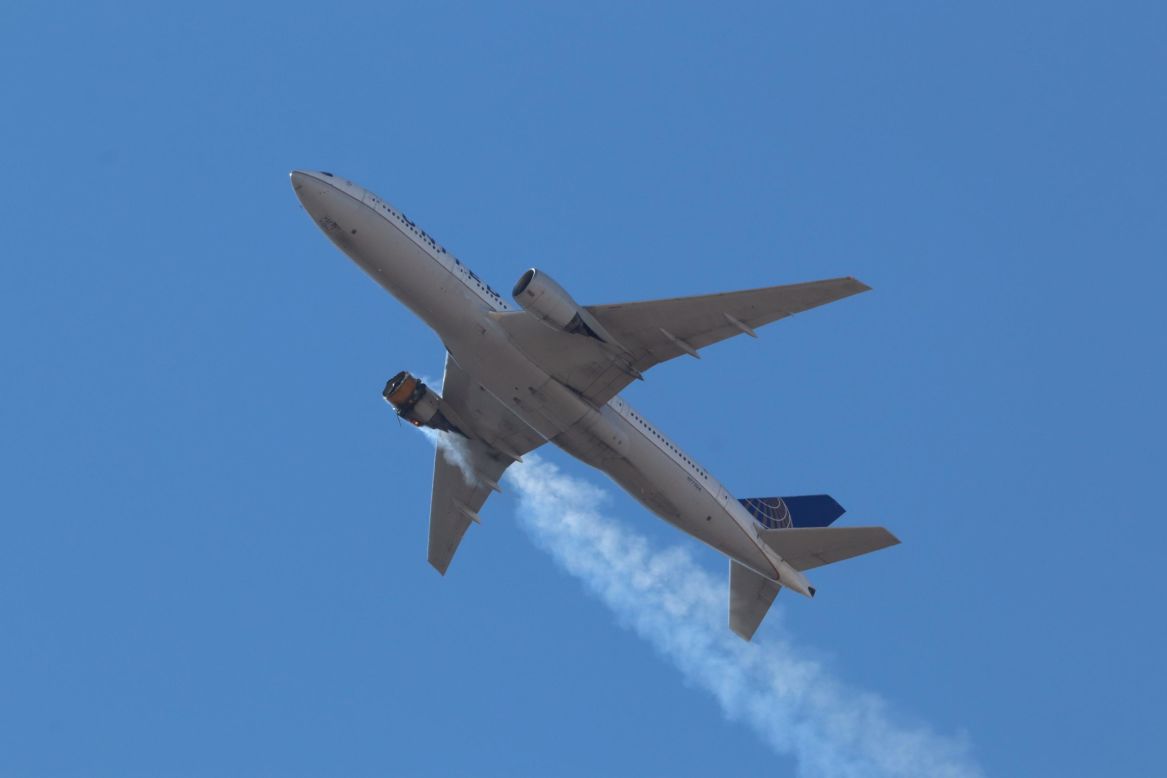 A United Airlines passenger jet flies over Denver with its starboard engine on fire on Saturday, February 20. <a href="https://www.cnn.com/2021/02/23/us/boeing-aircraft-engine-fail-tuesday/index.html" target="_blank">The engine failed</a> minutes into the flight. It was able to land safely, but it left a mile of debris in its wake.