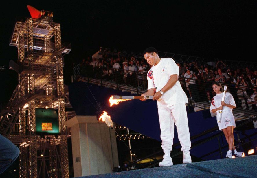 July 19, 1996 -- After developing Parkinson's disease and withdrawing from the public eye, Ali lit the Olympic cauldron, appearing as the secret final torchbearer for the Games in Atlanta.