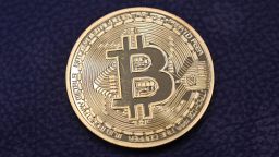 This photograph taken on December 17, 2020 shows shows a physical imitation of a Bitcoin at a crypto currency "Bitcoin Change" shop, near Grand Bazaar, in Istanbul. - Leading virtual currency bitcoin on 16 December traded above $20,000 for the first time following a sustained run higher in recent weeks. Bitcoin reached a record-high $20,398.50 before pulling back to $20,145, which was still an intra-day gain of nearly four percent. (Photo by Ozan Kose/AFP/Getty Images)