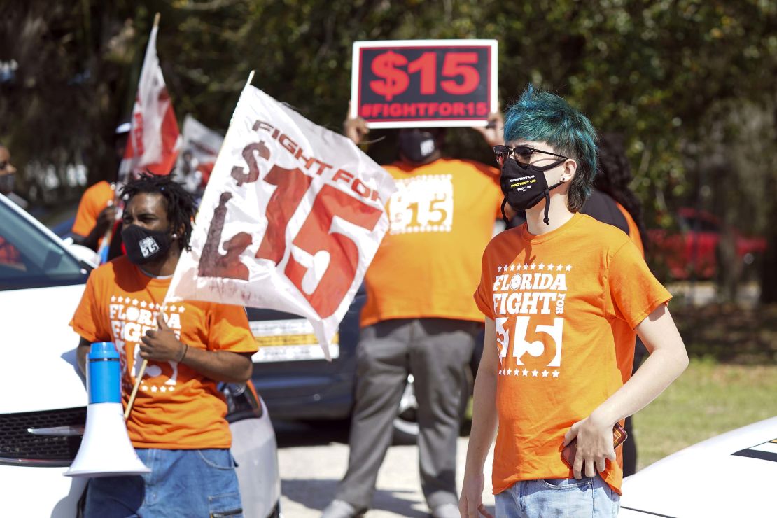Protesters attend a rally for a $15 hourly minimum wage on February 16, 2021, in Orlando, Florida.