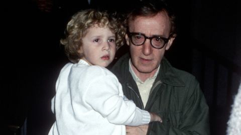 Woody Allen carries Dylan O'Sullivan Farrow near Allen's aparment in New York City on May 2, 1989.
