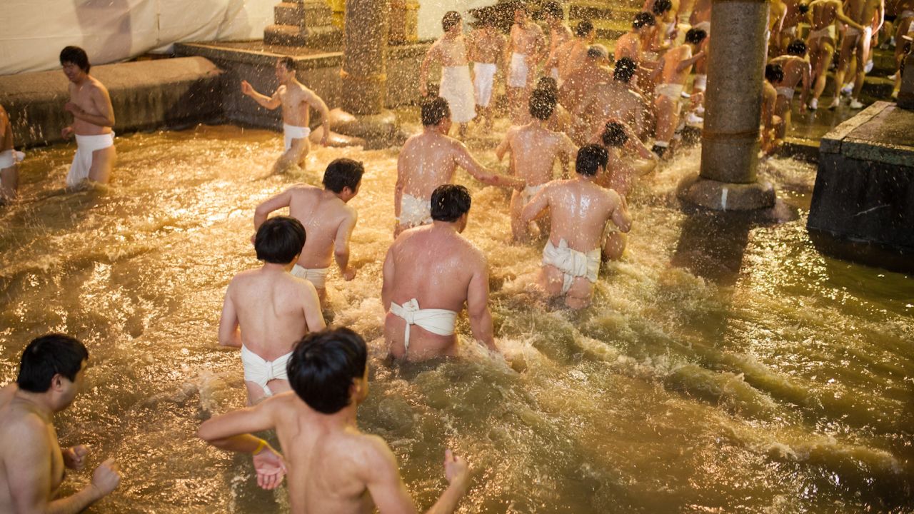 As part of the Naked Festival, participants purify themselves with freezing cold water before entering the main temple.