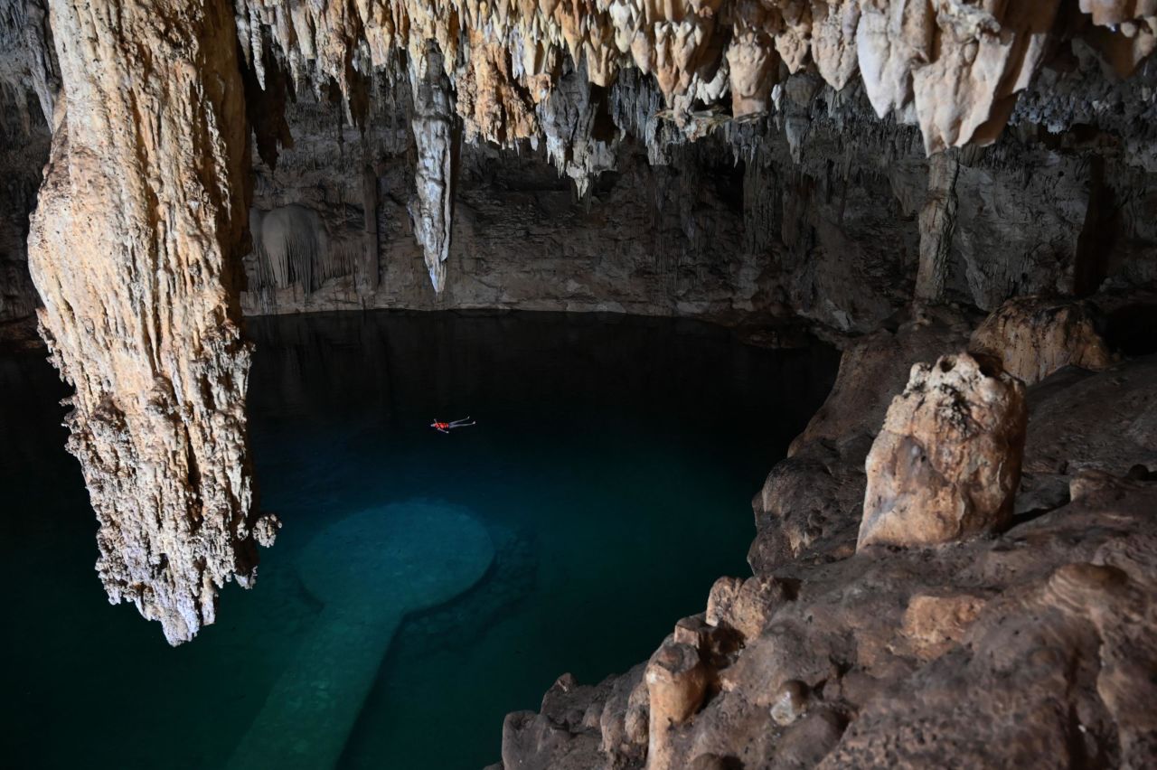 Tourists swim in the Cenote Suytun in Valladolid, Yucatan state, on December 15, 2020. 