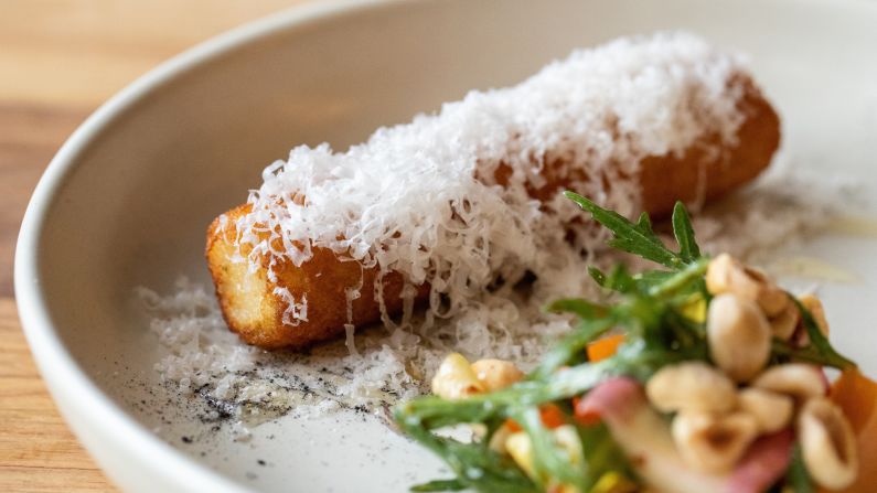 <strong>But everybody has their spin on it:</strong> Queenstown restaurant Rātā serves cheese rolls as an entrée, garnished with locally-sourced preserved apricots, hazelnuts, truffle oil and honey from the southern rātā tree.