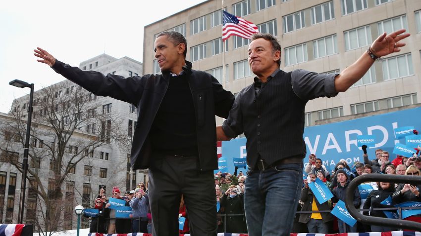 MADISON, WI - NOVEMBER 05:  U.S. President Barack Obama and rocker Bruce Springsteen wave to a crowd of 18,000 people during a rally on the last day of campaigning in the general election November 5, 2012 in Madison, Wisconsin. Obama and his opponent, Republican presidential nominee and former Massachusetts Gov. Mitt Romney are stumping from one 'swing state' to the next in a last-minute rush to persuade undecided voters.  (Photo by Chip Somodevilla/Getty Images)