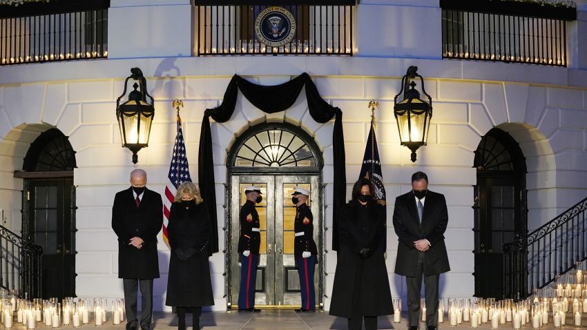 From left, President Joe Biden, First Lady Jill Biden, Vice President Kamala Harris and her husband Doug Emhoff, bow their heads during a ceremony to honor the 500,000 Americans that died from COVID-19, at the White House, Monday, Feb. 22, 2021, in Washington. (AP Photo/Evan Vucci)