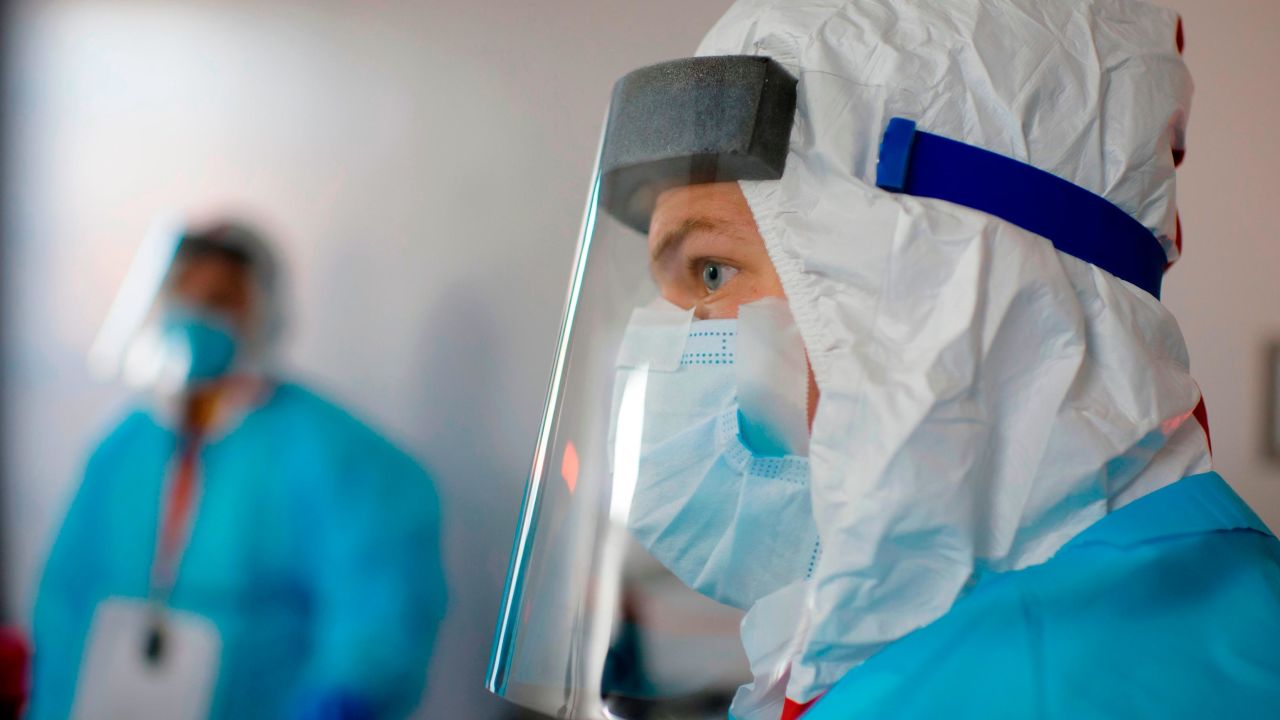 Jacques Bistre inspects a patient's vitals in the Covid-19 ward at United Memorial Medical Center in Houston, Texas on December 4, 2020. (Photo by Mark Felix / AFP) (Photo by MARK FELIX/AFP /AFP via Getty Images)