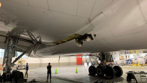 The damage to the wing and the body fairing of the United Airlines flight 328 Boeing 777-200, following an engine failure incident on Saturday, February 20, 2021. 