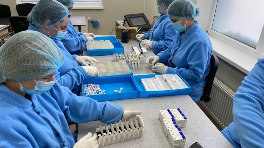 Vials of vaccine are packed at the Generium Pharmaceutical plant, which is gearing up production of Sputnik V.