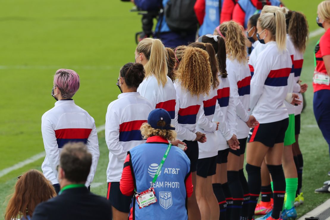 The USWNT remained standing for the national anthem on Sunday. 