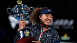 TOPSHOT - Japan's Naomi Osaka holds the Daphne Akhurst Memorial Cup trophy after beating Jennifer Brady of the US to win their women's singles final match on day thirteen of the Australian Open tennis tournament in Melbourne on February 20, 2021. (Photo by Paul CROCK / AFP) / -- IMAGE RESTRICTED TO EDITORIAL USE - STRICTLY NO COMMERCIAL USE -- (Photo by PAUL CROCK/AFP via Getty Images)