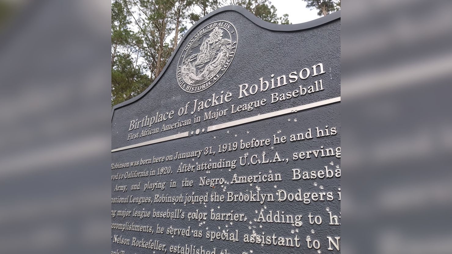 A historical marker that commemorates the birth of Jackie Robinson in rural Georgia was found covered in bullet holes last week, according to the Georgia Historical Society. 