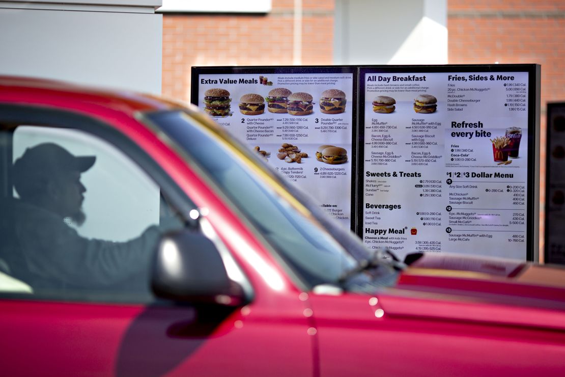 A customer views a digital menu at the drive-thru outside a McDonald's restaurant in Peru, Illinois.