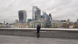 General view of the City of London as a man walks past amid the lockdown on February 19, 2021. 