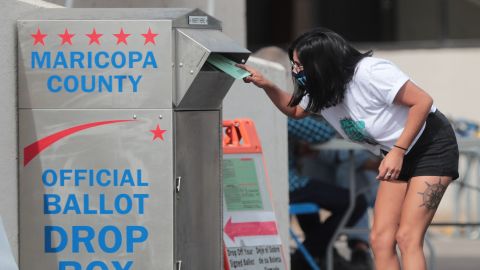 Veronica Garcia drops off a ballot at the Maricopa County elections office in Phoenix on November 1, 2020.