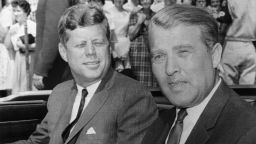 President John F. Kennedy and rocket scientist Wernher von Braun squint into the sun after Kennedy's arrival for a closeup look at the latest in the nations rocket "hardware." 