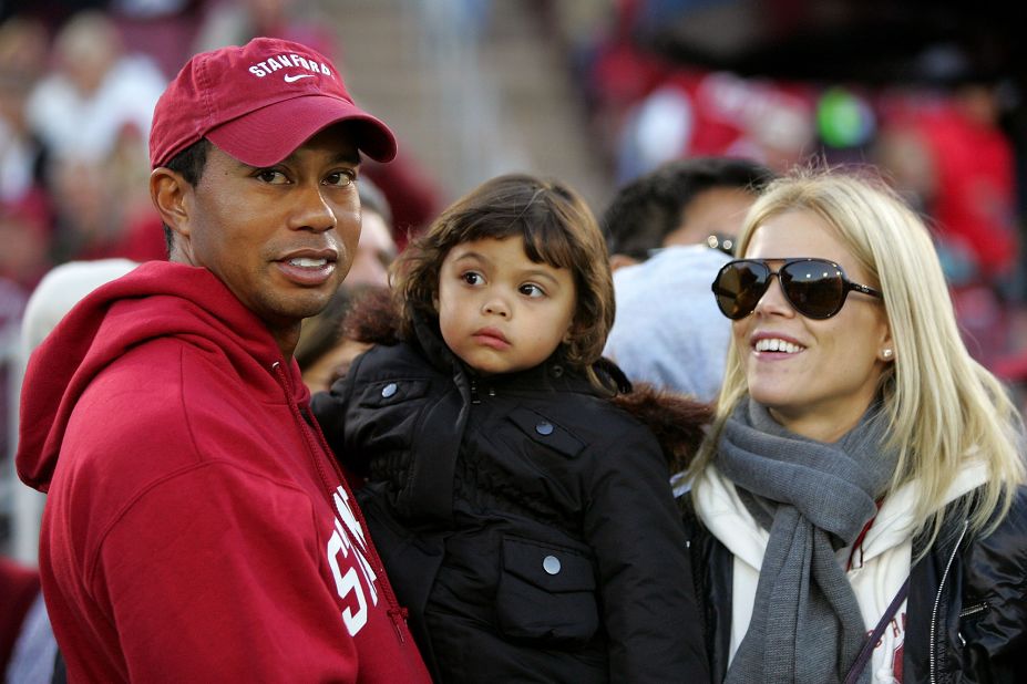 Woods holds his daughter, Sam, as he and his wife, Elin, attend a Stanford football game in November 2009. Woods married Elin, a model, in 2004. The couple also have a son, Charlie.
