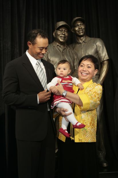 Woods stands with his mother, Kultida, and his daughter, Sam, as a statue of him and his father is unveiled at the Tiger Woods Learning Center in Anaheim, California, in January 2008.