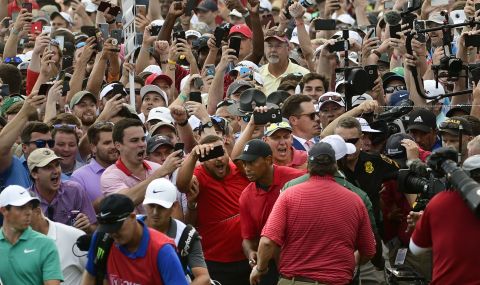Woods is trailed by jubilant fans during the final round of the Tour Championship in Atlanta in 2018. It was <a href="https://edition.cnn.com/2018/09/23/golf/tiger-woods-tour-championship-spt-intl/index.html" target="_blank">his first PGA Tour victory since 2013.</a>