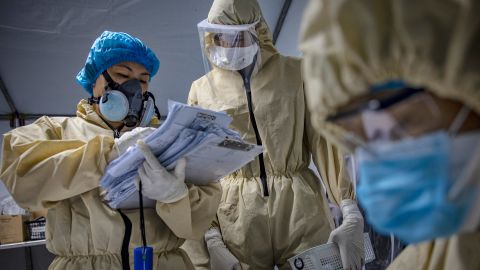 Medical personnel work inside a makeshift nurse station at a parking lot converted into a Covid-19 isolation facility at the National Kidney and Transplant Institute Hospital in Quezon city, Metro Manila, Philippines, on May 1, 2020.