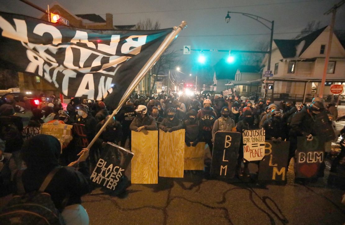 Protesters march in Rochester on February 23, 2021
