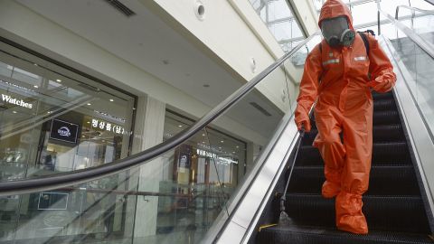 A worker sprays disinfectant at a department store in Pyongyang on August 7, 2020, amid concerns over the coronavirus.