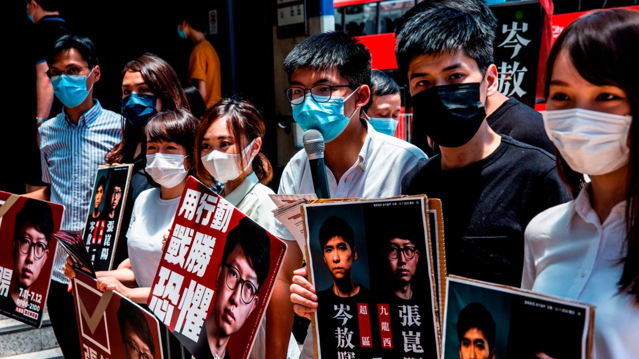 Pro-democracy candidates campaign for election in July 2020. Tiffany Yuen (middle-left) and Lester Shum (second-right) face expulsion from their district council seats under new oath requirements. Joshua Wong (middle-right) and Agnes Chow (right) are both currently in prison.