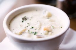 Classic New England clam chowder combines a thick base with starchy potatoes.