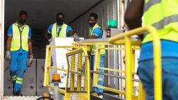Airport workers unload a shipment of Covid-19 vaccines from the Covax global Covid-19 vaccination programme, at the Kotoka International Airport in Accra, on February 24, 2021. - Ghana received the first shipment of Covid-19 vaccines from Covax, a global scheme to procure and distribute inoculations for free, as the world races to contain the pandemic. Covax, launched last April to help ensure a fairer distribution of coronavirus vaccines between rich and poor nations, said it would deliver two billion doses to its members by the end of the year. (Photo by Nipah Dennis / AFP) (Photo by NIPAH DENNIS/AFP via Getty Images)