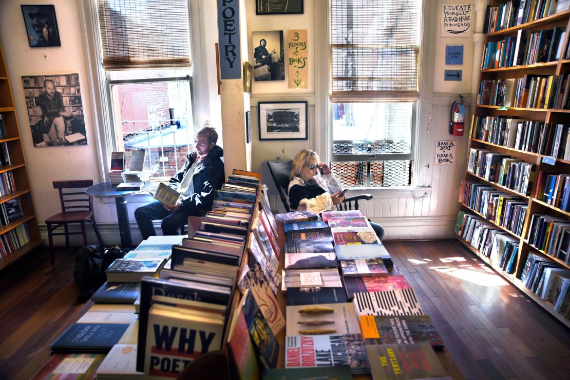 Customers peruse books in the Poetry Room at City Lights Bookstore in San Francisco, California. 