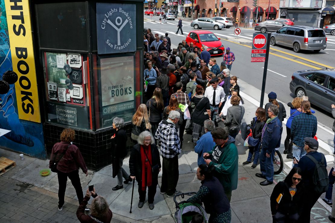 Hundreds of people outside City Lights Bookstore on Sunday, March 24, 2019, in San Francisco, Calif. Lawrence Ferlinghetti was celebrated on his 100th birthday. 