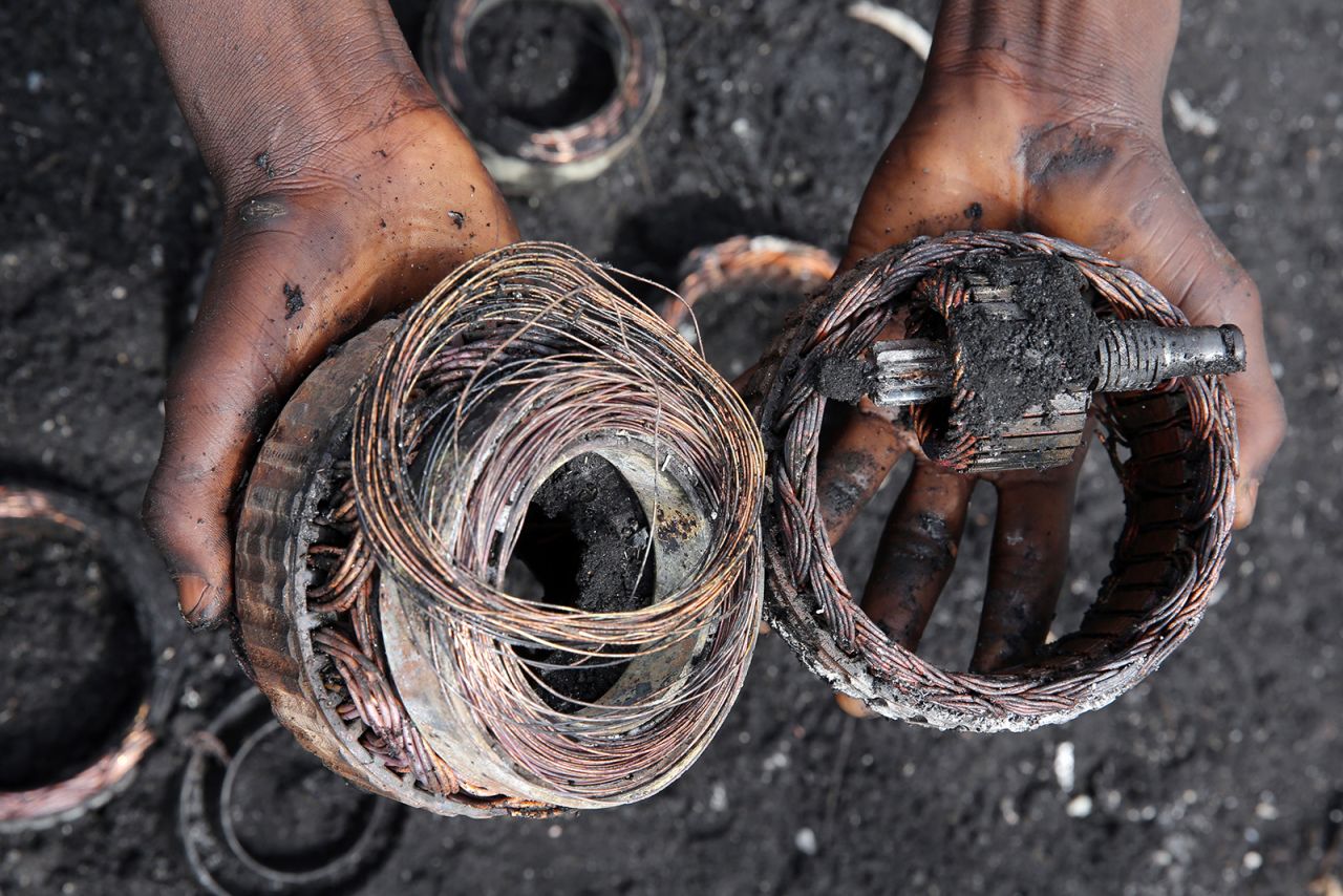 Fire has exposed these copper windings from old electronics. E-waste is defined as products with circuitry and a power supply or battery. The gamut of e-waste runs from toys and appliances to everyday home and office electronics, which end up at dump sites around the world when not properly recycled.
