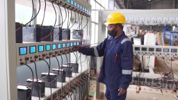 Solar products and batteries contain hazardous chemicals that can harm the environment if not properly disposed. A technician at Enviroserve Recycling facility tests and recharge batteries for second hand use.