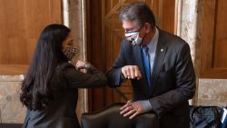 Chairman Joe Manchin (C), D-WV, greets Congresswoman Deb Haaland, D-NM, during the Senate Committee on Energy and Natural Resources hearing on her nomination to be Interior Secretary on February 23, 2021 in Washington, DC. If confirmed, Haaland would become the first Native American Cabinet secretary in U.S. history.