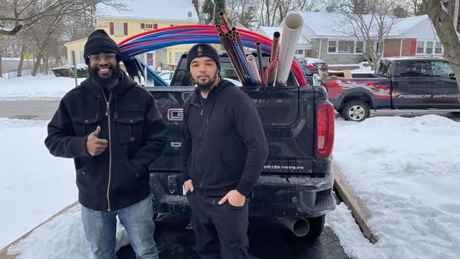 New Jersey plumber Andrew Mitchell, right, and his apprentice Isaiah Pinnock have been working in the Houston, Texas, area since Sunday because local plumbers have been overwhelmed with calls.