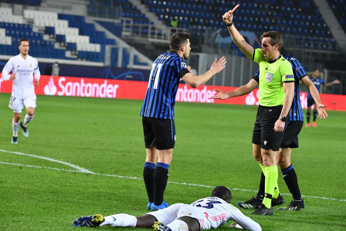 German referee Tobias Stieler shows a red card to Atalanta's Remo Freuler.