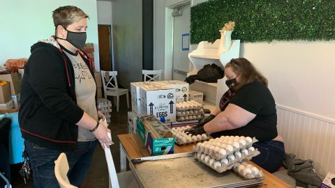 Bakery co-owners Janessa and Jessica Tomberlin prepare food to give away at Crema Bakery on February 23, 2021.