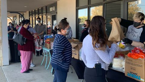 Owner Janessa Tomberlin hands out free food at Crema Bakery in South Austin on February 23, 2021