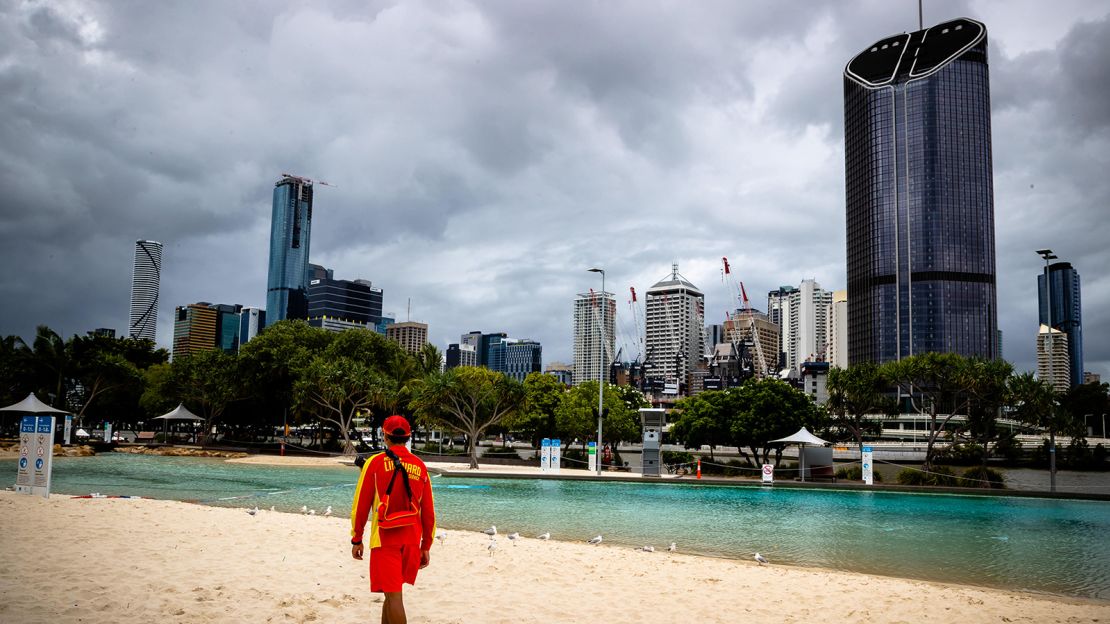 A lifeguard stands watch over a deserted South Bank beach in Brisbane on January 9 amid a snap coronavirus lockdown.