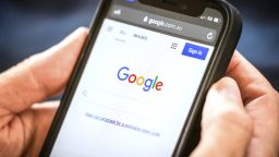 A link to Google's proposal to a workable news code on the company's homepage, arranged on an iPhone in Sydney, Australia, on Friday, Jan. 22, 2021. Google threatened to disable its search engine in Australia if its forced to pay local publishers for news, a dramatic escalation of a months-long standoff with the government. 