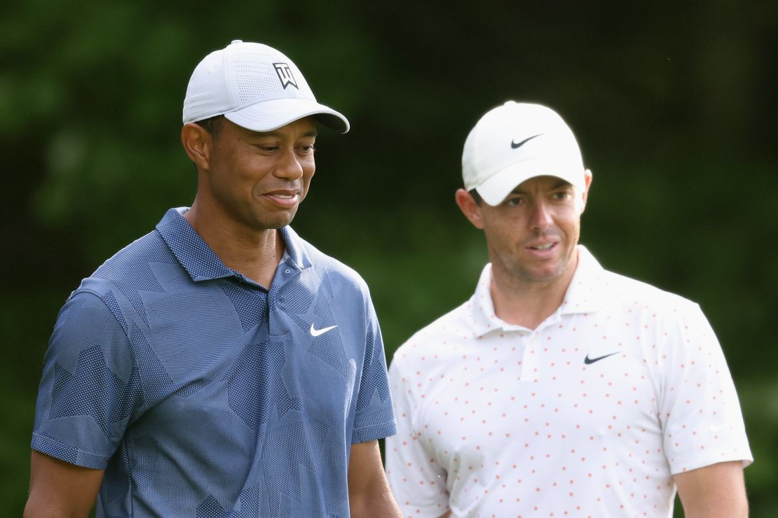 McIlroy (right) and Woods wait on the first tee during the third round of The Northern Trust.